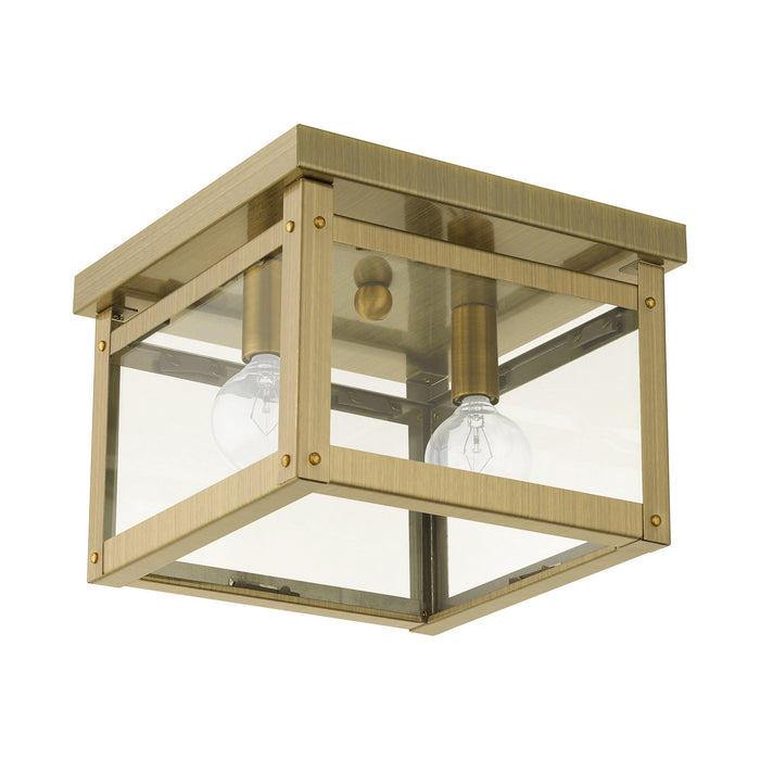 Two Light Flush Mount from the Milford collection in Antique Brass finish