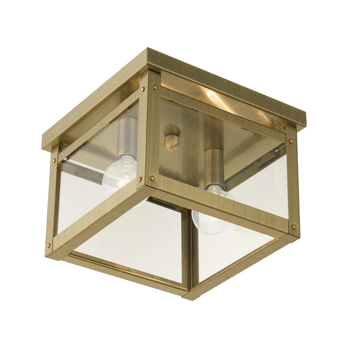 Two Light Flush Mount from the Milford collection in Antique Brass finish