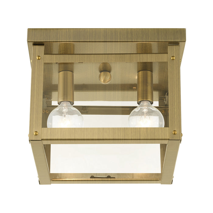 Two Light Flush Mount from the Milford collection in Antique Brass finish