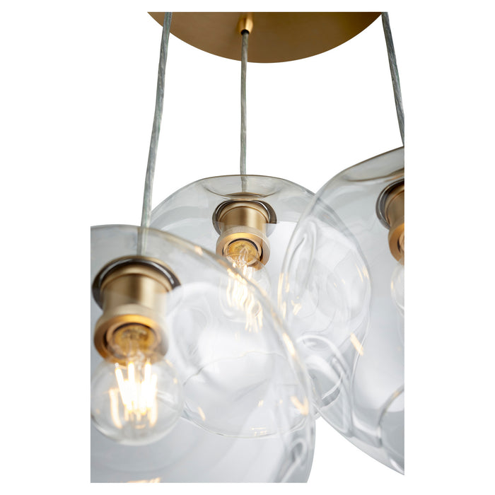 Three Light Pendant from the Numen collection in Aged Brass finish